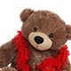 The Giant Teddy bear, adorned in a red scarf, is the ideal teddy bear gift, backed by a money-back guarantee.